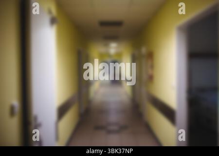 Long straight corridor is stretching in flat design with yellow walls, brown railings, tiled floor Stock Photo