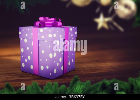 Flat design is showing purple dotted gift box, pink ribbon among green branches and golden baubles Stock Photo