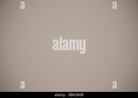 plain beige gradient background is spreading across flat design canvas with soft radial variation Stock Photo