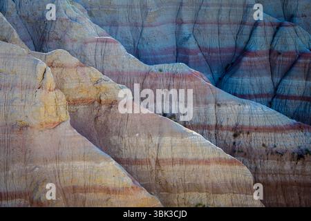 Abstract image of rock formations with colorful pattern and stripes at Badlands national park, South Dakota, USA. Stock Photo