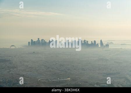 Doha, Qatar - June 10, 2025: humid and dusty Doha skyline view in summer Stock Photo