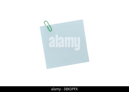 Adhesive notes or Sticky notes, A single green paperclip secures a blank light blue square note, isolated on a white background include clipping path Stock Photo