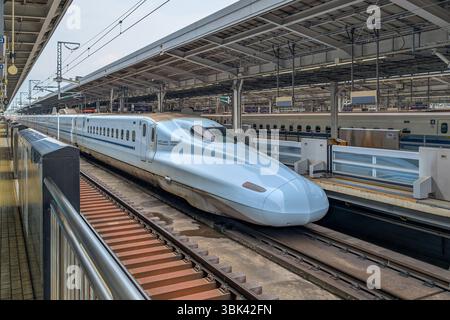 Shinkansen high speed bullet train arriving at Tokyo station, Japan Stock Photo