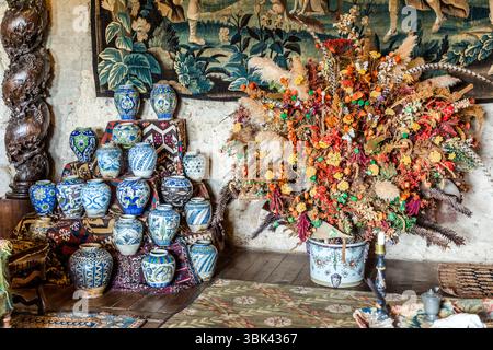 The Château de Boussac in Creuse is a medieval fortress with a rich history. Since the 1960s, collectors Lucien Blondeau and Bernadette Bondeau have furnished the château with numerous tapestries and all kinds of antiques and collectibles. Chemin du Grand Moulin, Boussac, Nouvelle-Aquitaine, France Stock Photo