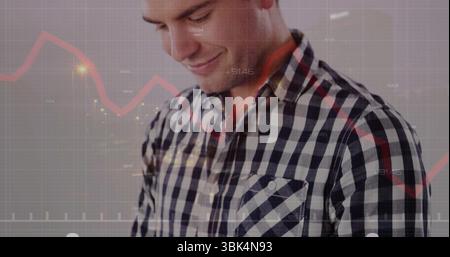 Analyzing checkered shirt man reviewing red line graph in studio, with gridlines and axis labels Stock Photo