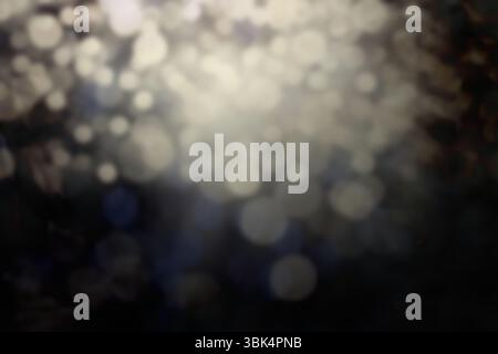 Abstract circular light spots are floating over dark blurred background, flat design Stock Photo