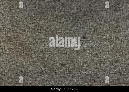 Dark urban paving texture in cold gray tones. Industrial concrete mosaic pattern for backgrounds, architecture, and design concepts. Stock Photo