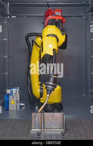 Automatic Welding Torch Robot Arm Metal Beam Workshop Stock Photo