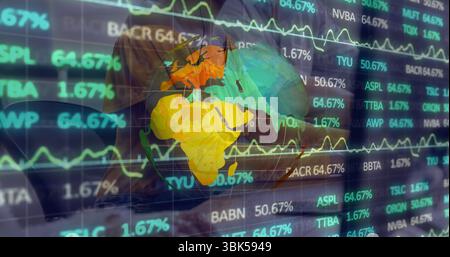Projecting holographic globe showing charts and ticker on trading floor, with suited professionals Stock Photo