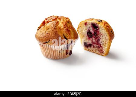 Whole and halved golden brown muffins filled with blueberries isolated on white background Stock Photo