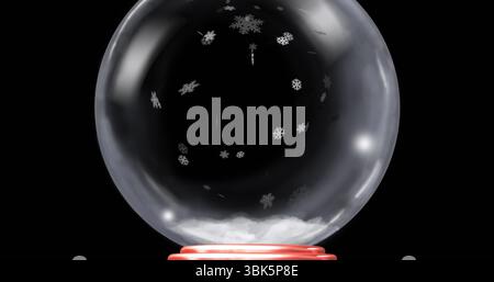 Resting glass globe containing white granules, snowflakes on red base at product photography setup Stock Photo