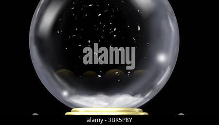 Displaying glass snow globe with swirling white snowflakes on studio setup, metallic gold-tone base Stock Photo