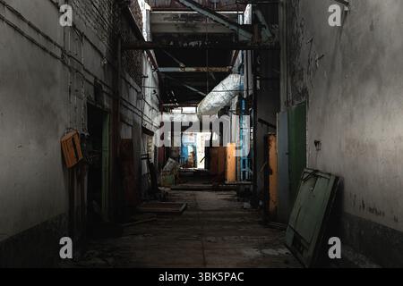 Abandoned corridor in factory at Chernobyl Exclusion Zone Stock Photo