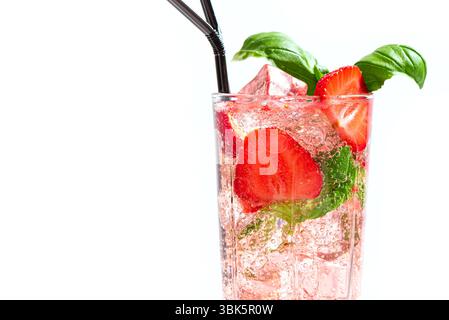 Strawberry and basil Mojito cocktail or mocktail close up isolated on white background, copy space. Trendy sparkling drink, summer cocktail party and Stock Photo