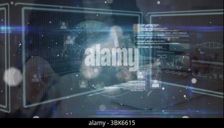 Navigating woman interacting with holographic panels at laptop, displaying skull and DNA helix Stock Photo