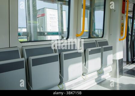 Empty modern metro cabin from inside on the move during the ride. Driverless metropolitan of Copenhagen, Denmark, clean and comfortable mode of transp Stock Photo