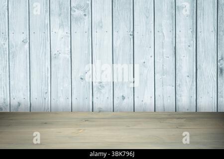Displaying flat wooden tabletop with visible grain, knots against gray vertical-plank wall backdrop Stock Photo