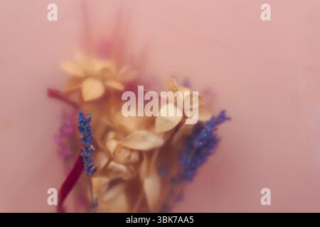 A bouquet of lavender and dried flowers in boho style with blurred effect soft focus. An artistic still life, floral arrangement featuring wildflowers Stock Photo