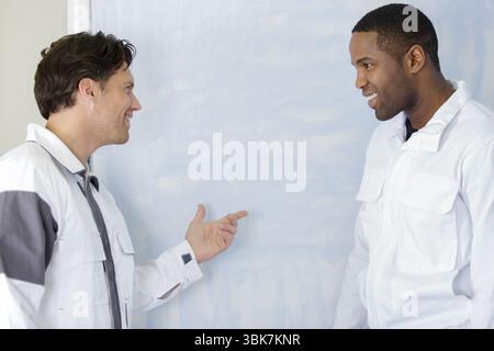 house painters laughing about something Stock Photo