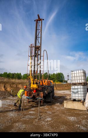 Pile Sampling Belovo, Russia - May 18, 2025: Close-up of soil sampling during pile ...