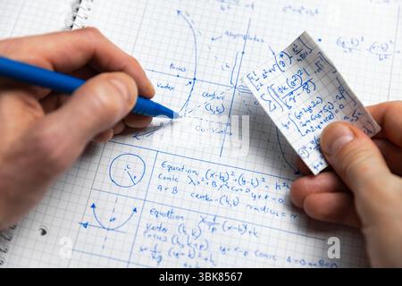 Written Math exercise in notebook closeup Stock Photo