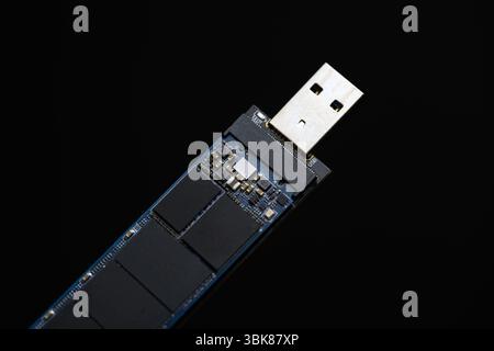 Solid state drive against dark isolated background closeup Stock Photo