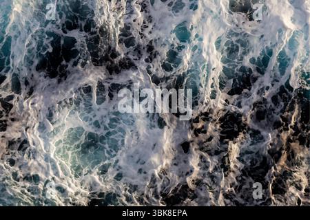 Water surface texture. Aerial view of mesmerizing water with foam. Stock Vector