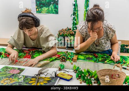 Weavers at the Cité internationale de la tapisserie in Aubusson are working on a motif by Japanese artist Hayao Miyazaki, "My Neighbour Totoro". The motif consists of 200 shades of green. The carpet will eventually measure 31 square metres. Rue Williams Dumazet, Aubusson, Nouvelle-Aquitaine, France Stock Photo
