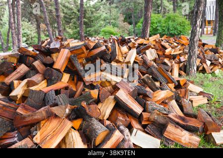Large pile of firewood ready to be burnt closeup Stock Photo