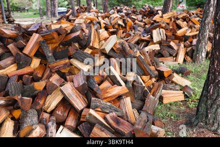 Large pile of firewood ready to be burnt closeup Stock Photo