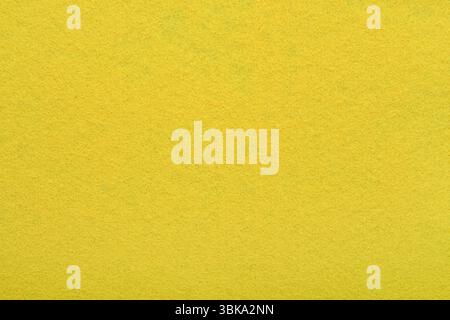 Yellow felt texture background - close-up of soft fabric surface. Seamless background, graphic design, scrapbooking, textile layouts creative project Stock Photo