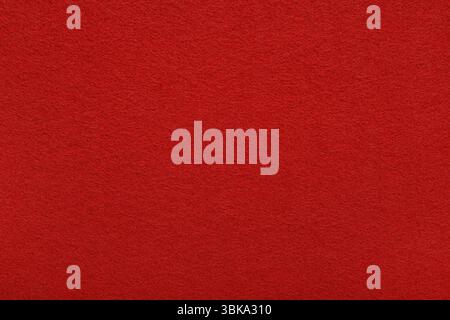 Red felt texture background - close-up of soft fabric surface. Seamless background, graphic design, scrapbooking, textile layouts, creative projects. Stock Photo
