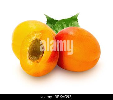 A vibrant composition of fresh, ripe apricots, one whole and one halved revealing its pit, accompanied by green leaves. Perfectly isolated on a pure w Stock Photo