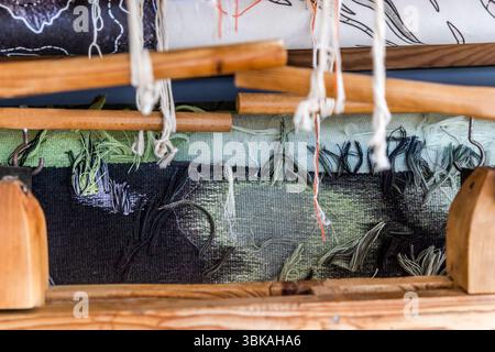 Close-up of the back of the tapestry "Hommage à George Sand" by Francoise Petrovitch on the loom. The Robert Four studio will work on the large-format tapestry for two years with three weavers. The work is to be presented to the public in June 2026 on the 150th anniversary of George Sand's death. Rue Madeleine, Aubusson, Nouvelle-Aquitaine, France Stock Photo