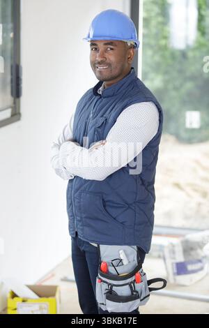 portrait of a tradesman wearing a tool belt Stock Photo
