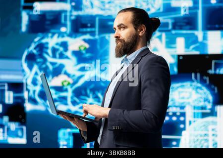 Male IT expert interacting with a digital AI neural network to symbolize machine learning and algorithmic thinking for smart tech innovation and future development strategy. Data science. Stock Photo