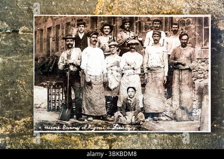 A group picture of workers at the kiln of a porcelain factory in Limoges, Haute-Vienne, Nouvelle-Aquitaine, France, hangs in the Four des Casseaux museum (Musée du Four des Casseaux) on Rue Donzelot. The workers' postures and facial expressions are unusually relaxed and individual. The photographer is unknown. The handwritten caption reads "usine Barny et Rigoni à Limoges". In English: "Barny and Rigoni factory in Limoges". Men in long aprons, shirts and hats stand in front of a stone building, two of them holding shovels. A boy sits on the ground at the front. The museum preserves a porcelain Stock Photo