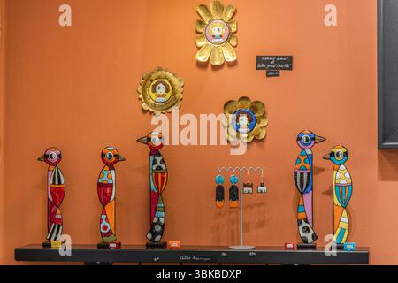 Limoges was the leading centre for pit-fired enamel in the Middle Ages from the 12th to 14th centuries. The famous works were mostly produced for sacred purposes - crosses, reliquaries and liturgical book covers made of copper, which were filled with enamel powder and fired.  To this day, ‘Limoges enamel’ stands for particularly high-quality, artistically painted art objects made of copper or metal, which are coated with coloured enamel and fired several times. Here are objects by the artist Delphine Peytour-Quendolo. Boulevard Louis Blanc, Limoges, Nouvelle-Aquitaine, France Stock Photo