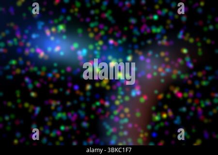 Glowing multicolored dots are scattering over dark background, creating confetti-like bokeh effect Stock Photo