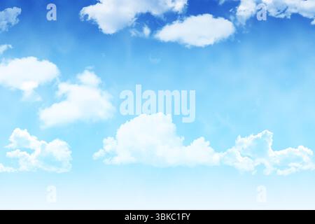 Scattered white cumulus clouds are drifting across vibrant blue flat design background Stock Photo