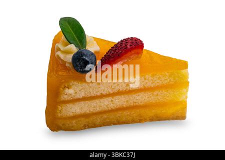 A slice of homemade orange layered cake topped with piece of strawberry, blueberry green leaf and white cream isolated on white background with clippi Stock Photo