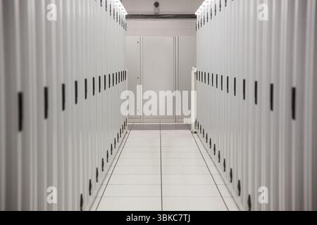 Showing data center corridor in flat design featuring racks, floor panels, cable trays, blank panel Stock Photo