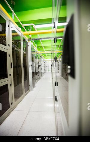 Flat design server room corridor is being shown with white floor, network cables and green beams Stock Photo