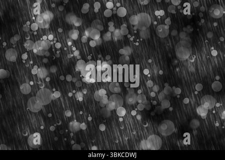 Abstract flat illustration showing heavy rain streaks and circular bokeh lights in gray tones Stock Photo