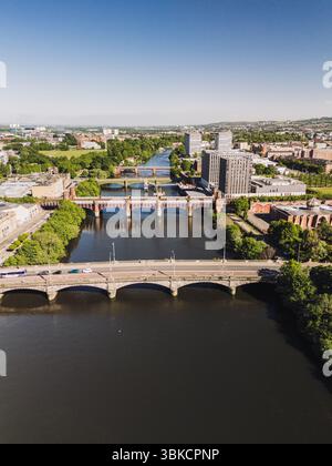 Glasgow Scotland: 18th May 2025: Drone photo of River Clyde bridges with City of Glasgow College exterior on sunny day nautical training facility Stock Photo