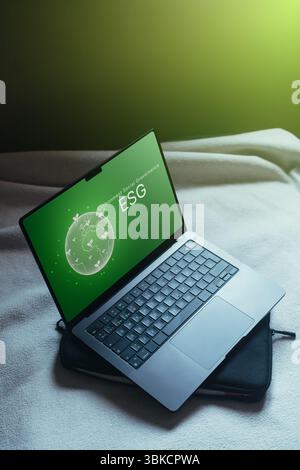 Holographic interface of ESG on laptop for business investment strategy. ESG environmental social governance investment business concept. Stock Photo