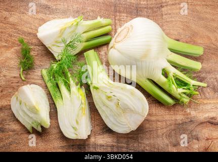 Florence fennel bulbs or finocchio bulbs on wooden table top view. Stock Photo