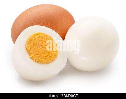 Hard-boiled chicken eggs and half of egg with yellow hard yolk on white background. File contains clipping path. Stock Photo