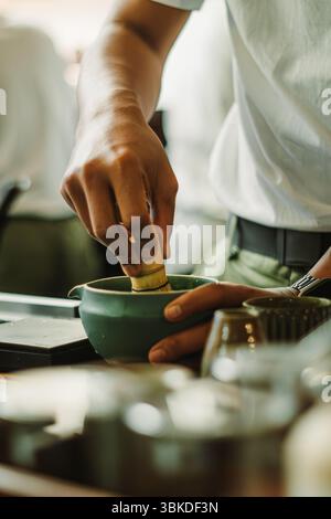 Hands whisking matcha. A traditional Japanese green tea. The calming ...