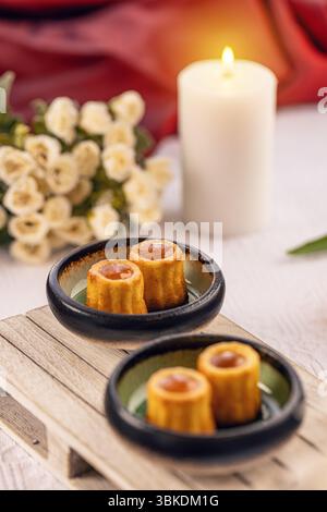 Small cakes with caramel filling served on miniature pallet Stock Photo